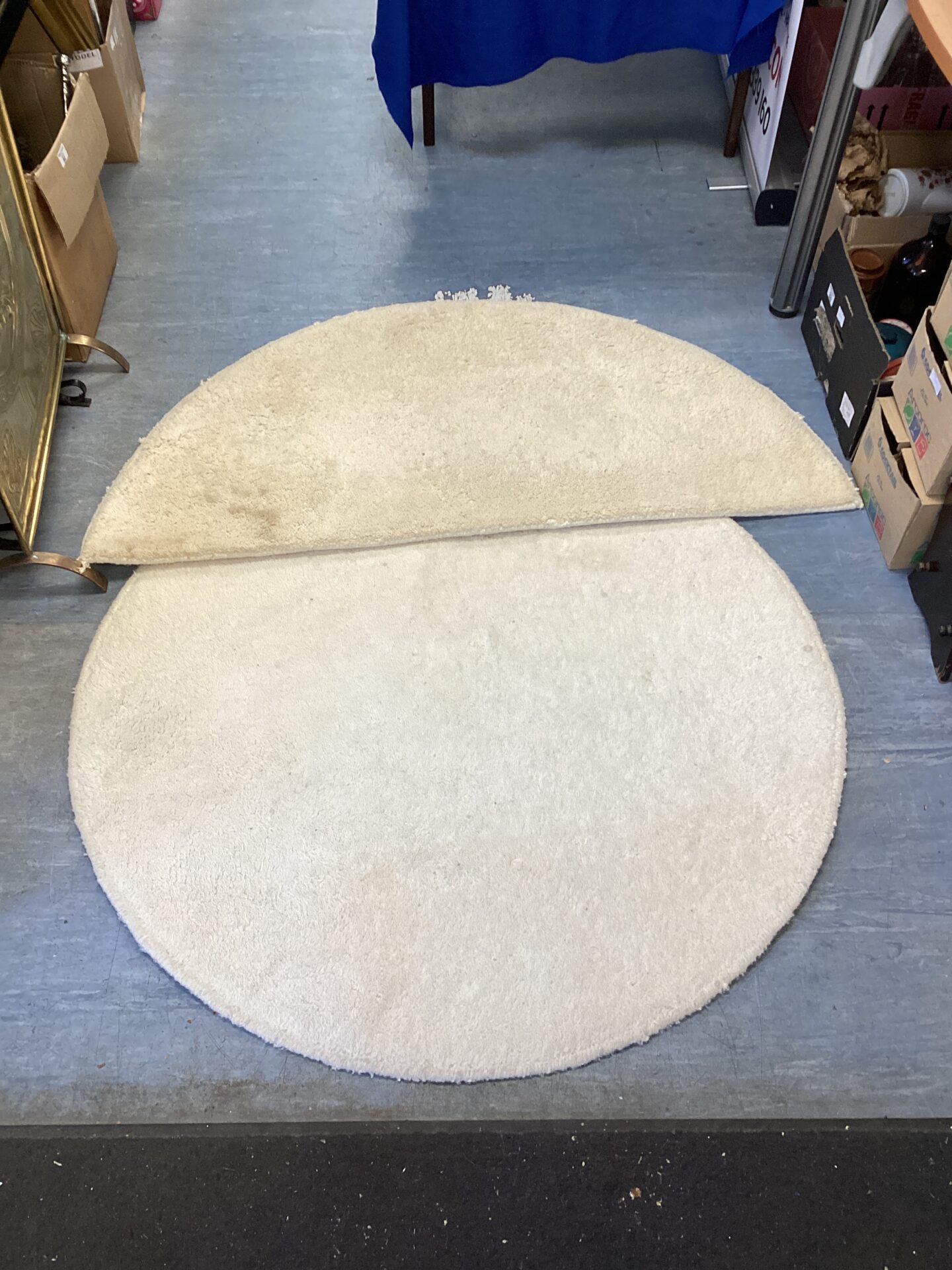 598 Two cream rugs one circular & one semi circle