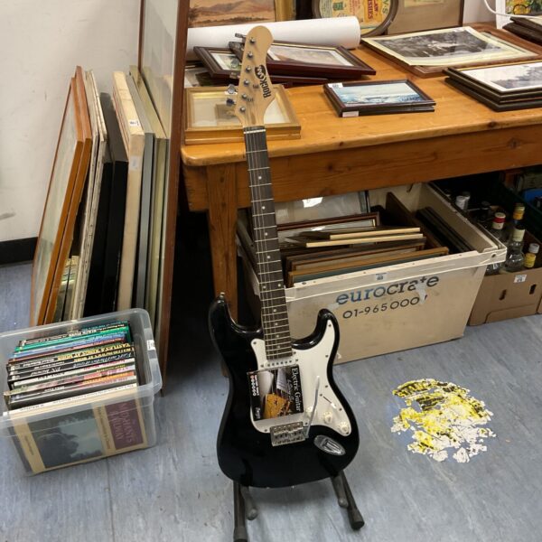 Black rock jam electric guitar with new strings.