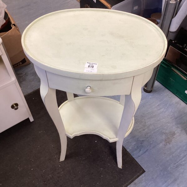 Cream painted oval occasion table with drawer.