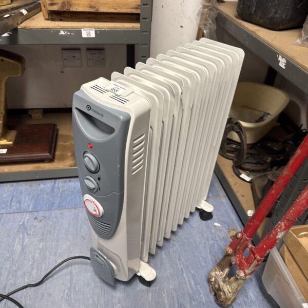 Vintage Puremate electric heater with adjustable settings.