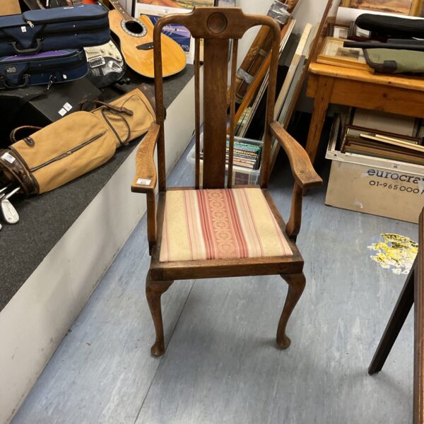 Antique Chippendale open armchair in oak with upholstered seat.