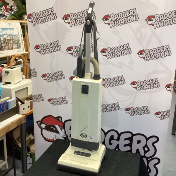 Sebo upright vacuum cleaner in a home setting.