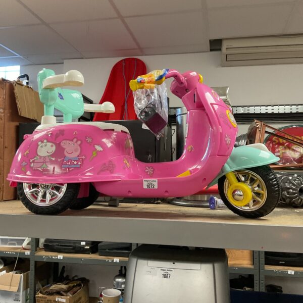 Pink Peppa Pig electric ride-on bike for toddlers.