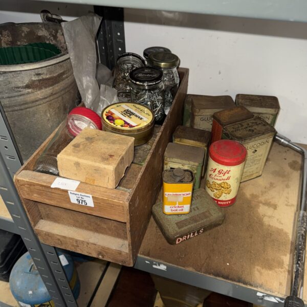 Vintage shed clearance lot featuring antique tins and screws.