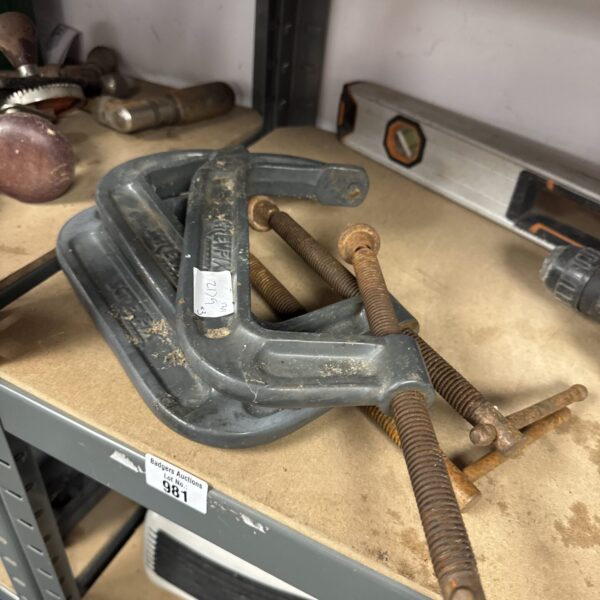 Set of three vintage metal G clamps for woodworking.