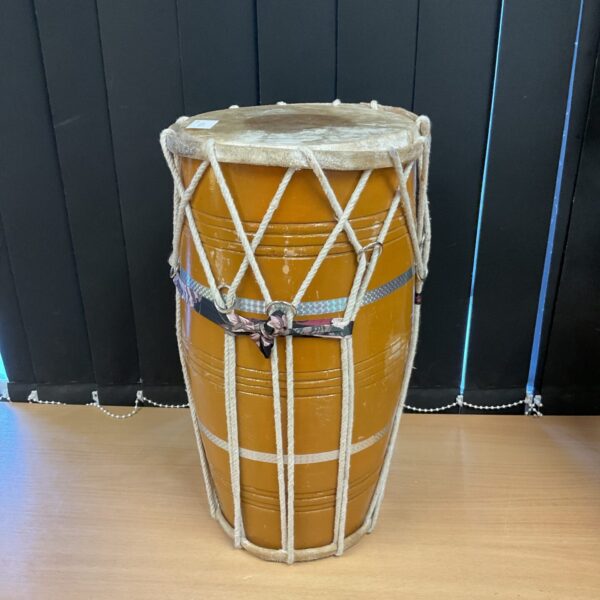 Vintage double-ended bongo drum with rope bindings.