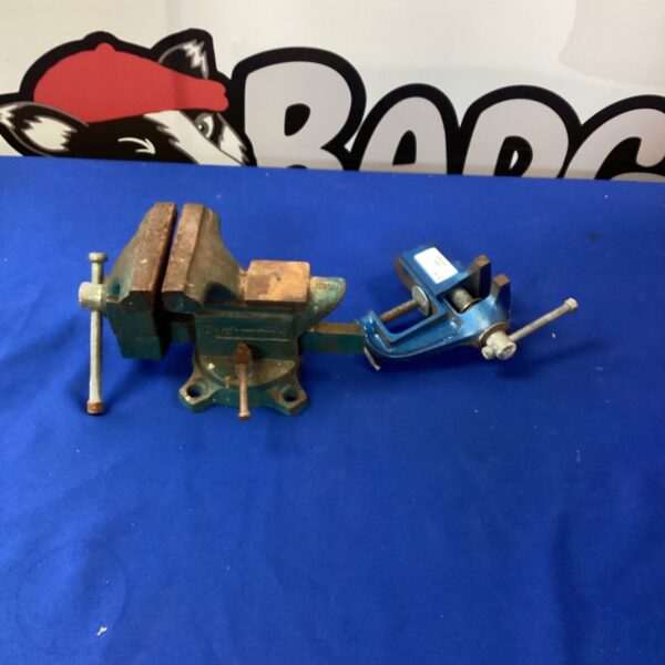 Small metal bench vice for workshop use.