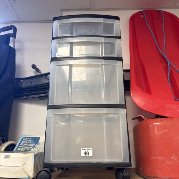 Four drawer plastic storage unit for home organisation.