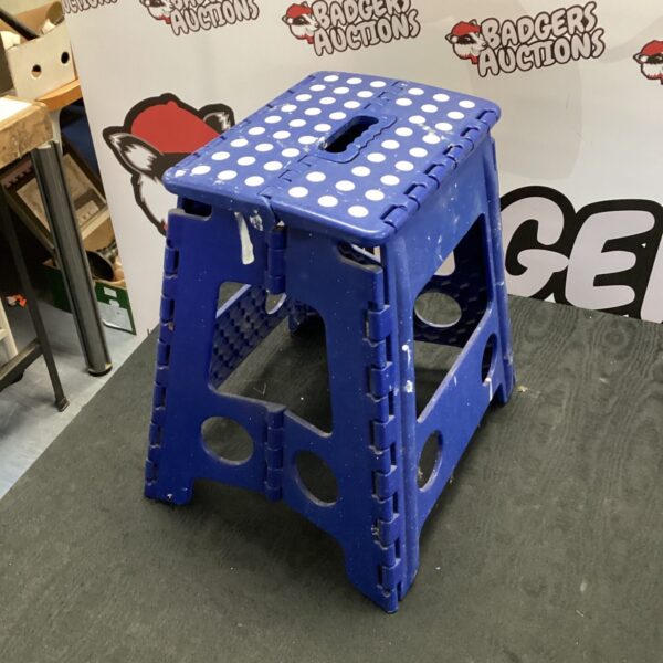 Blue plastic folding decorators stool for portable work.