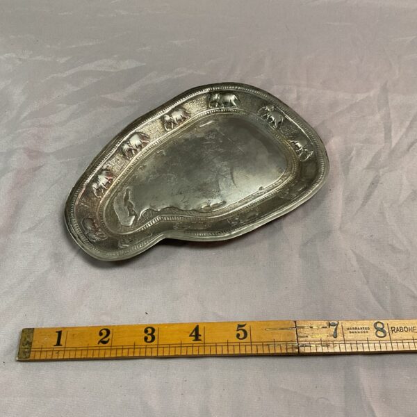 Antique Indian silver dish with elephant design, detailed silverwork.