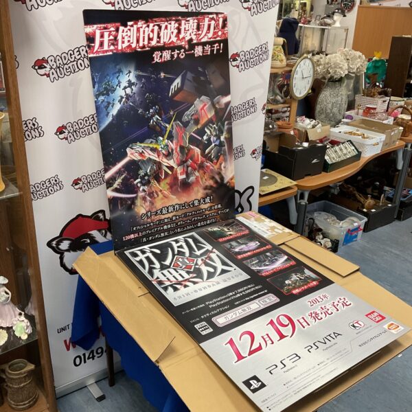 Front view of a large Japanese Gundam shop display board.