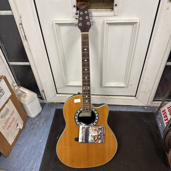Jim Deacon aov 105c acoustic guitar with natural wood finish.