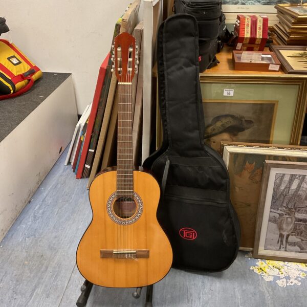Jose Ferrer El Primo acoustic guitar with hard case displayed.