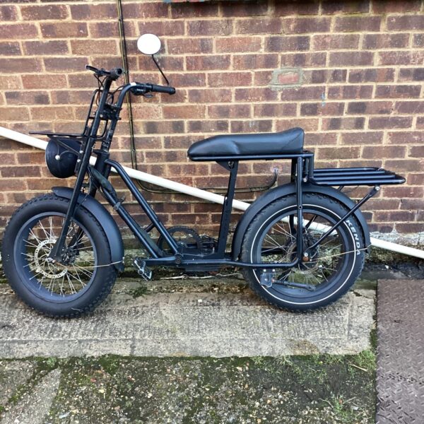 Retro Knaap electric bike with chunky tyres and step-through frame.