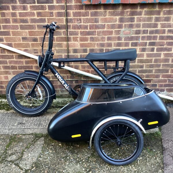 Knaap electric bike with sidecar, a unique utility vehicle.