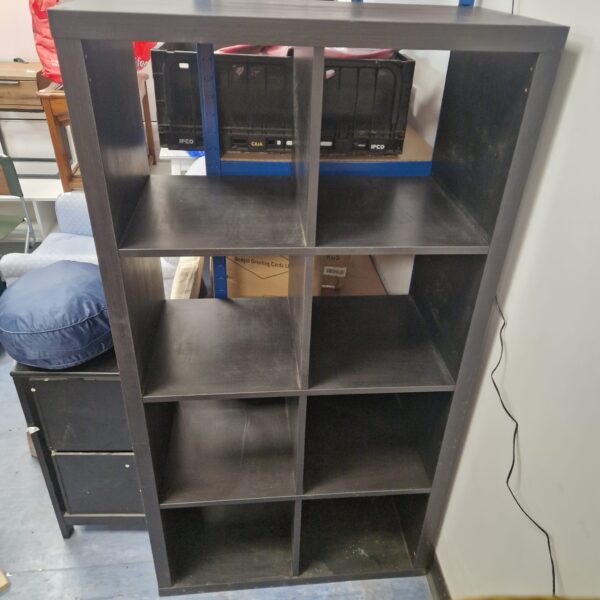 Front view of a black display unit with multiple compartments.