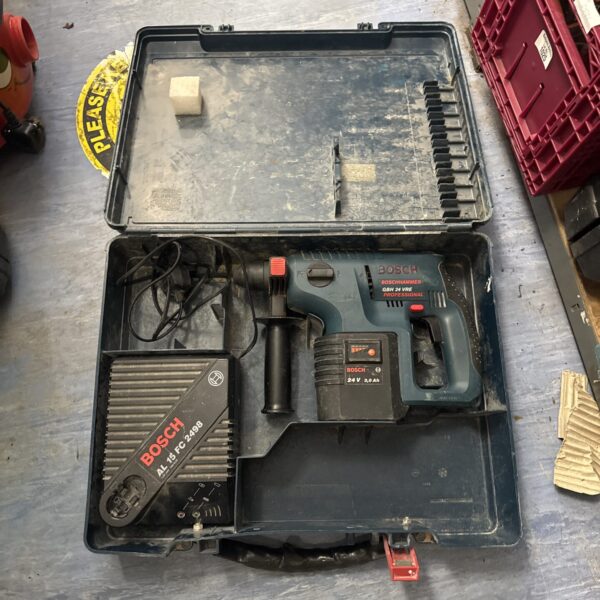 Vintage Bosch 24V cordless drill set in open carrying case.
