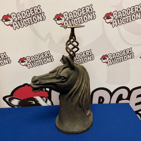 Dark metal horse head candle holder, detailed equestrian decor.