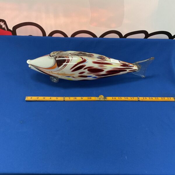 Vibrant Murano glass fish sculpture with swirling colours.