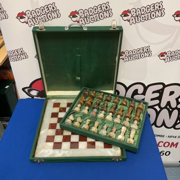 Vintage marble chess set in a felt-lined case, antique collectible game.