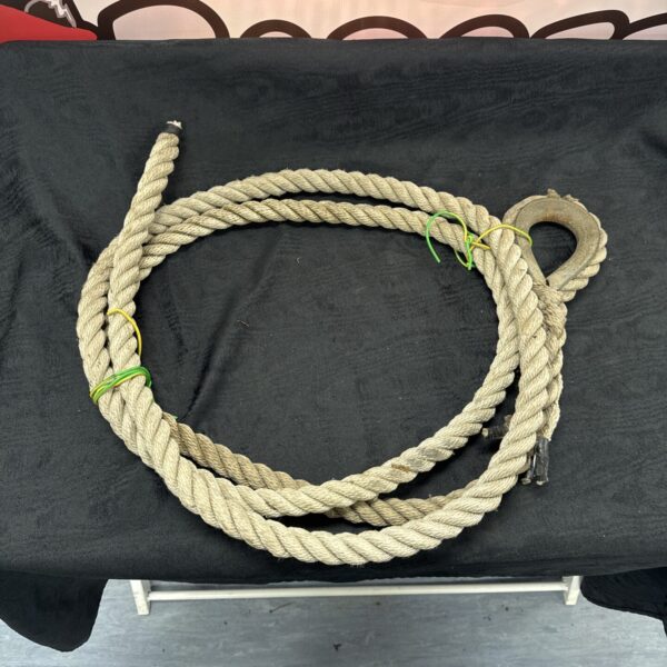 Coiled thick rope, ideal for nautical or industrial use.