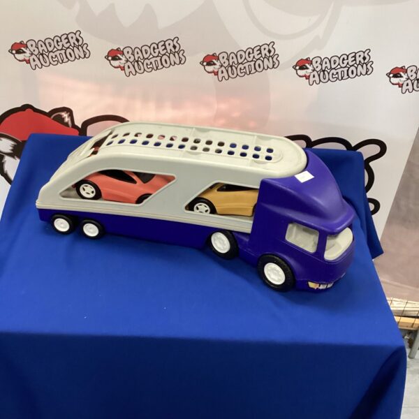 Little Tikes car transporter truck with cars loaded.