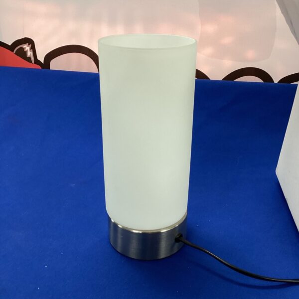 Modern white table lamp with silver base, Livatno Lux model.
