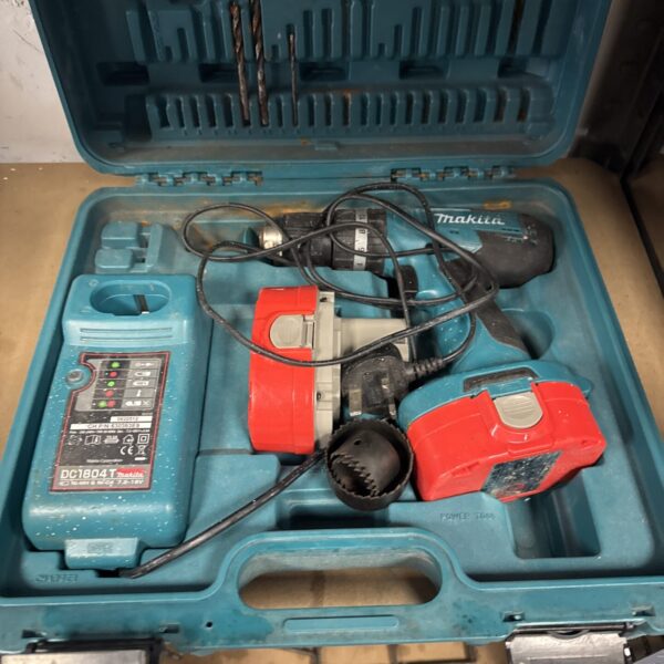 Makita cordless drill set in open carrying case with drill bits.