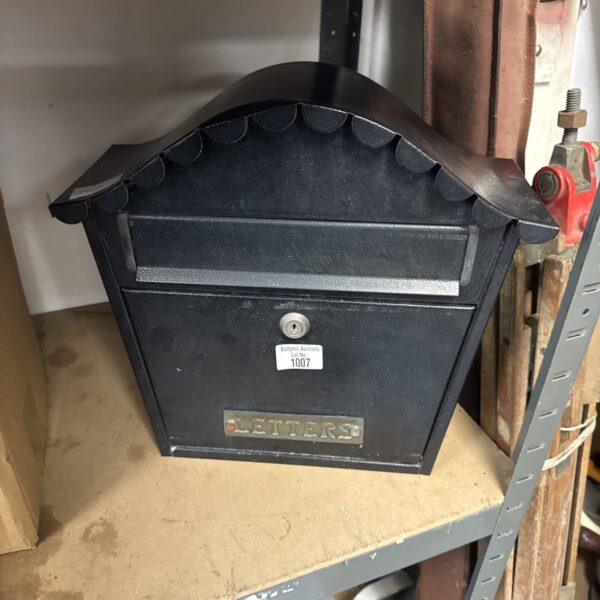 Vintage metal letter box with key, ideal for collectors.