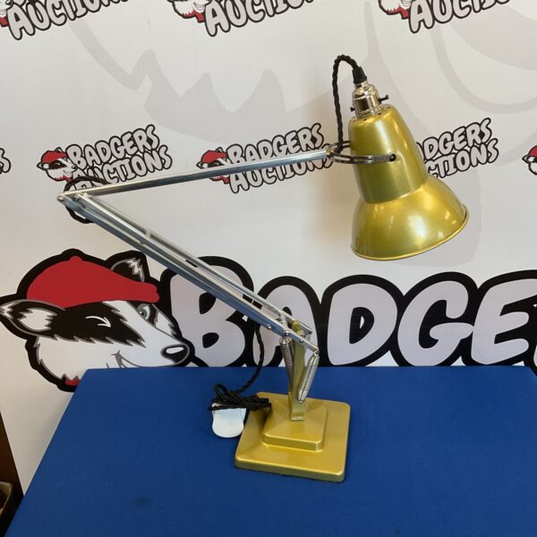 Vintage gold Anglepoise desk lamp with adjustable arm.