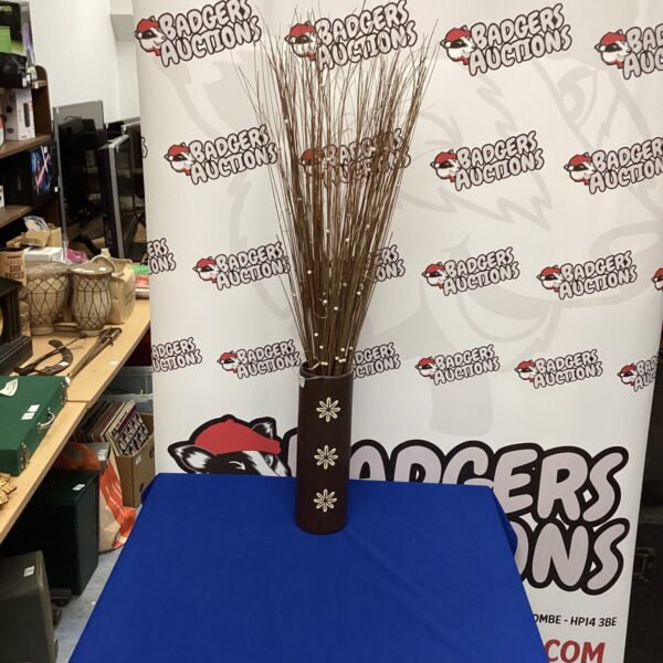 Modern pottery vase with a natural reed arrangement for home decor.