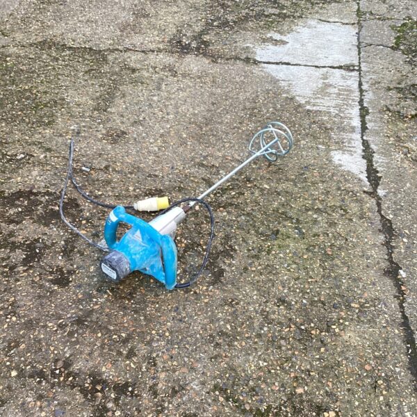 Handheld 110v mortar mixer for blending cement and plaster.