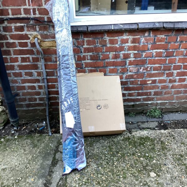 New Guinness pub umbrella and base still in packaging.