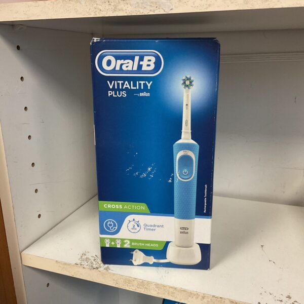 New Oral B CrossAction electric toothbrush in original packaging.
