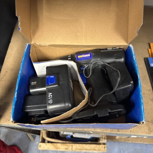 Vintage Nutool NPT121 cordless drill set in box.