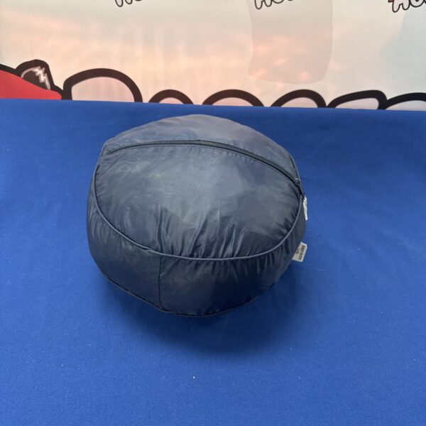 Nylon car cover folded in a storage bag, ready for use.