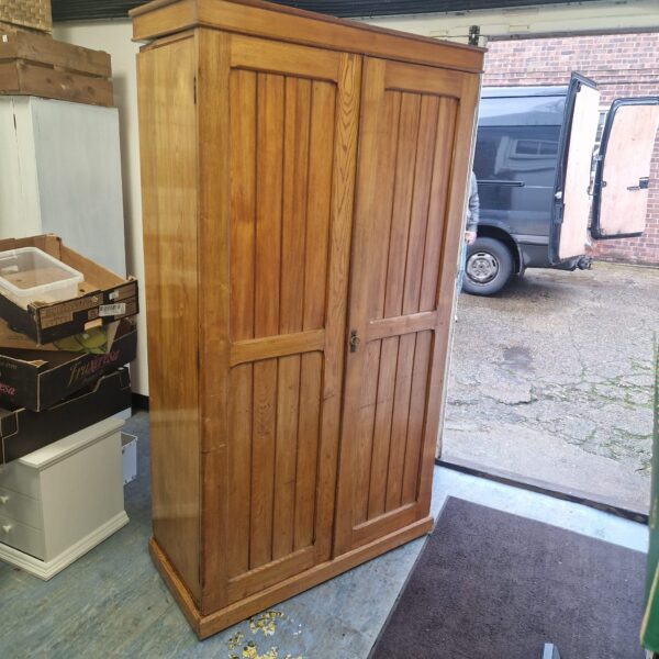 Vintage oak wardrobe with a single door, ideal for hall storage.