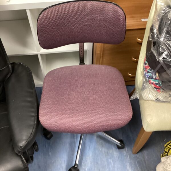 Side view of a purple vintage office chair.