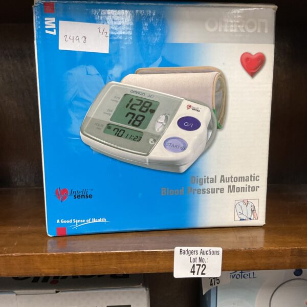 Omron digital automatic blood pressure monitor for home health tracking.