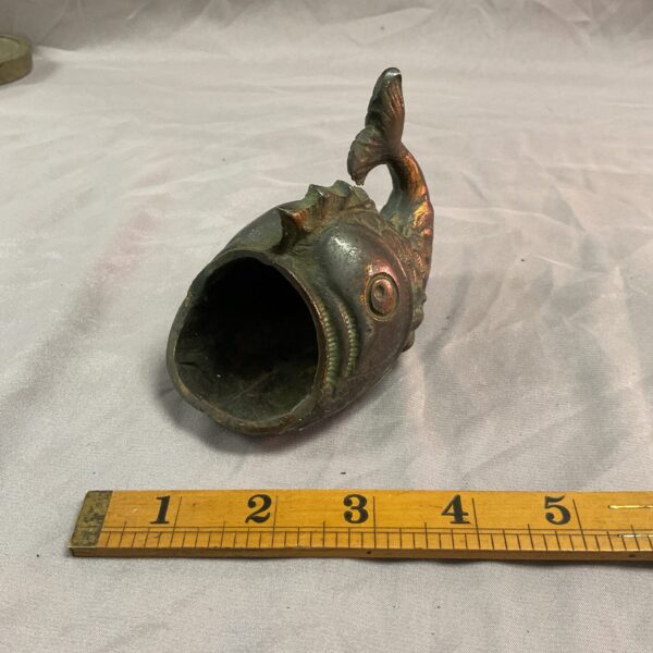 Antique oriental bronze fish sculpture with detailed scales.