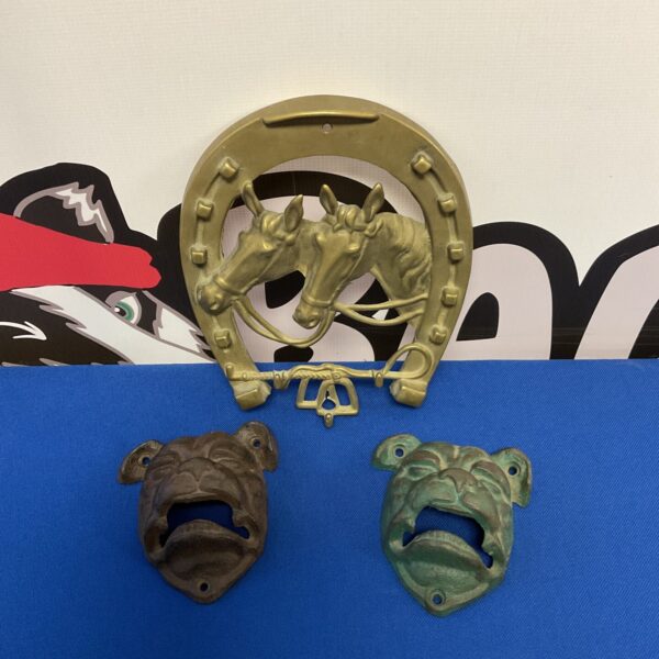 Vintage cast iron dog head bottle opener for collectors.