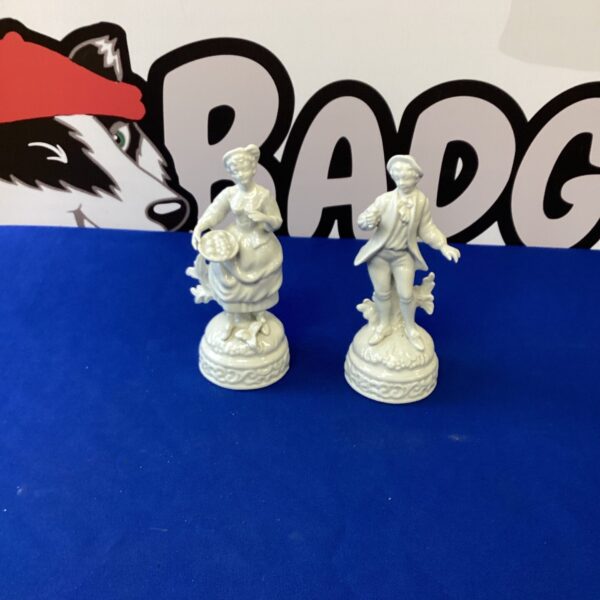Antique pair of blanc de Chine figurines, delicate porcelain ornaments.