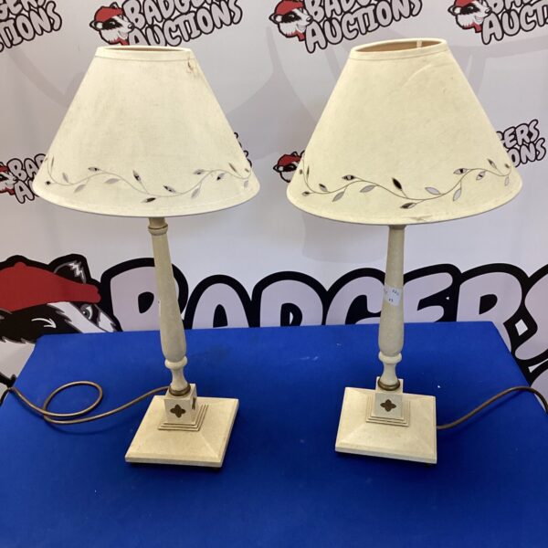 Pair of vintage wooden table lamps with cream shades.
