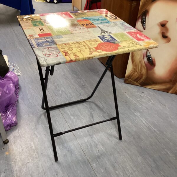Vintage Paris print folding table for small spaces.