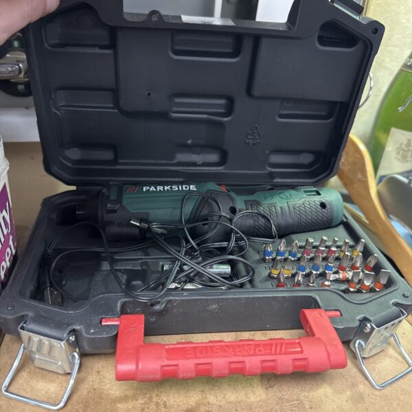 Open Parkside cordless screwdriver set with bits visible.