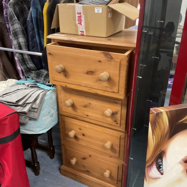 Vintage pine four-drawer chest with stuck drawers.
