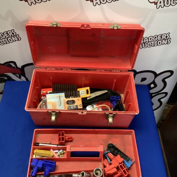 Vintage plastic tool box filled with various hand tools.