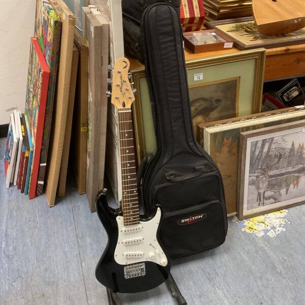 Black Playmate child's electric guitar with gig bag.