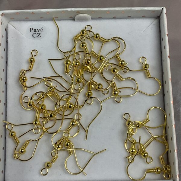 Silver gilt earring hooks for jewellery making, close-up view.