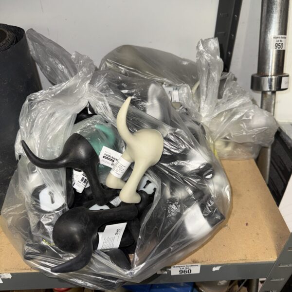 Quantity of new IKEA dog tail coat hangers in various colours.